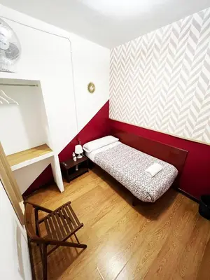 Cama o camas de una habitación en Hostal La Casa de La Plaza
