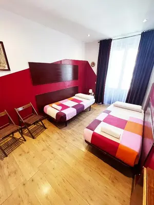 Cama o camas de una habitación en Hostal La Casa de La Plaza