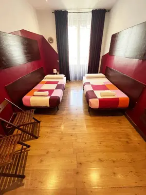 Cama o camas de una habitación en Hostal La Casa de La Plaza