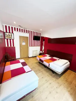 Cama o camas de una habitación en Hostal La Casa de La Plaza