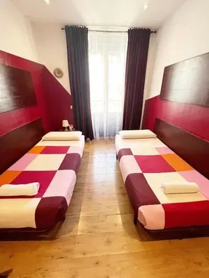 Cama o camas de una habitación en Hostal La Casa de La Plaza