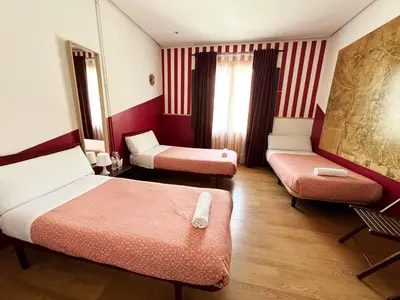 Cama o camas de una habitación en Hostal La Casa de La Plaza