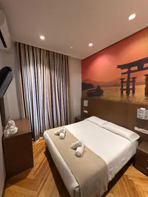 Cama o camas de una habitación en Hostal Atocha Almudena Martín