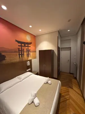 Cama o camas de una habitación en Hostal Atocha Almudena Martín