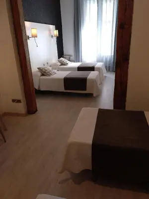 Cama o camas de una habitación en Hostal Aguilar