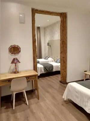 Cama o camas de una habitación en Hostal Aguilar