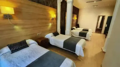 Cama o camas de una habitación en Hostal Aguilar