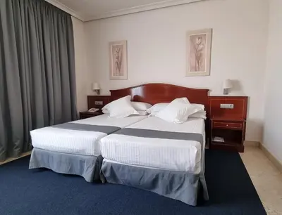 Cama o camas de una habitación en Hotel Gran Legazpi