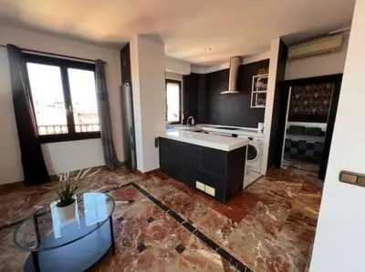 Una cocina o zona de cocina en Apartamentos El Tiempo Madrid