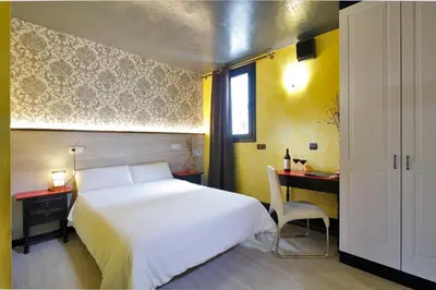 Cama o camas de una habitación en Apartamentos El Tiempo Madrid