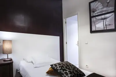 Cama o camas de una habitación en THC Gran Via Hostel