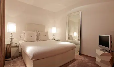 Cama o camas de una habitación en Abalú Collection Suites Gran Via