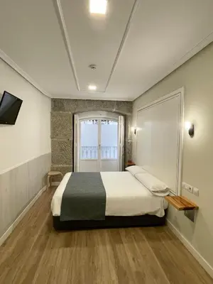 Cama o camas de una habitación en Hostal Madrid