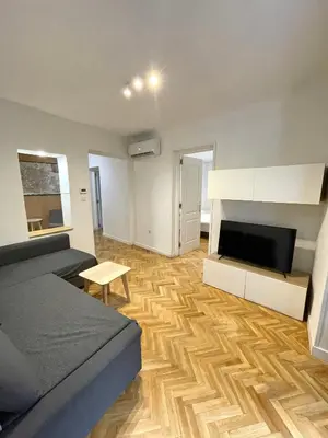 Una televisión o centro de entretenimiento en Apartamentos Mayor Centro