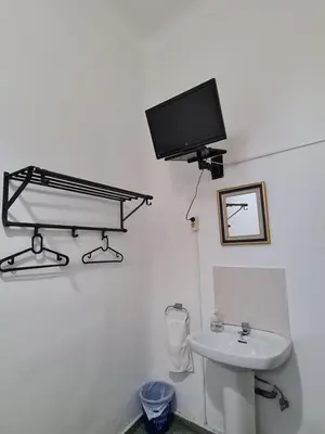 Una televisión o centro de entretenimiento en Pensión Berti Madrid