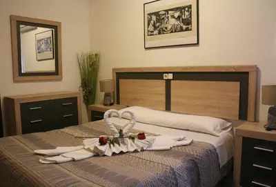 Cama o camas de una habitación en Pensión San Isidro