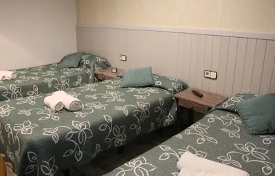 Cama o camas de una habitación en Pensión San Isidro