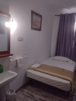Cama o camas de una habitación en Pensión San Isidro