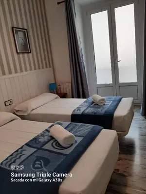 Cama o camas de una habitación en Pensión San Isidro