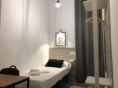 Cama o camas de una habitación en Hostal Rías Bajas