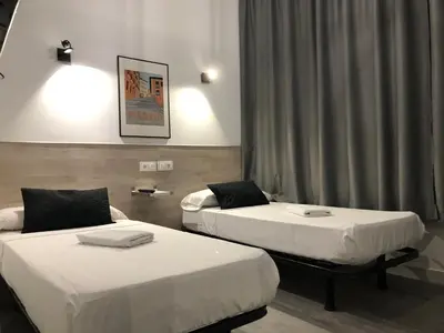 Cama o camas de una habitación en Hostal Rías Bajas