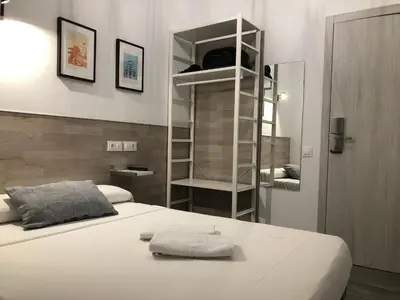 Cama o camas de una habitación en Hostal Rías Bajas