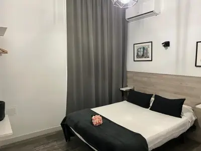 Cama o camas de una habitación en Hostal Rías Bajas