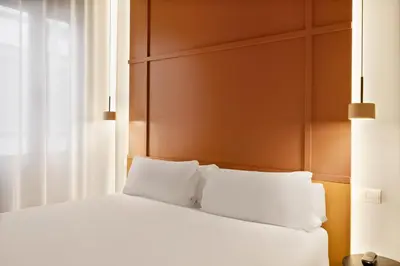Cama o camas de una habitación en B&B HOTEL Apartamentos Madrid Centro Fuencarral 46