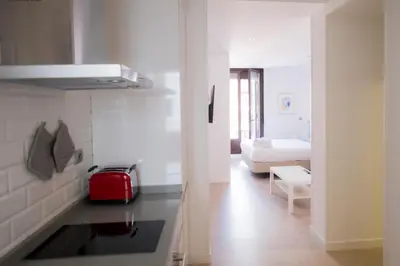 Cama o camas de una habitación en Arenal Suites Preciados