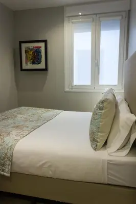 Cama o camas de una habitación en Arenal Suites Preciados