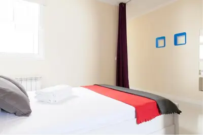 Cama o camas de una habitación en For You Rentals parque del retiro apartment TEMPORAL LDR286