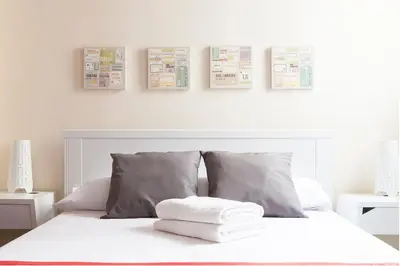 Cama o camas de una habitación en For You Rentals parque del retiro apartment TEMPORAL LDR286