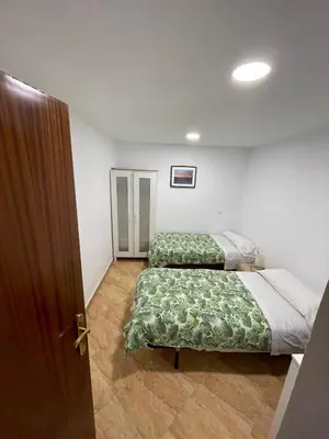 Cama o camas de una habitación en Pradera de San Isidro