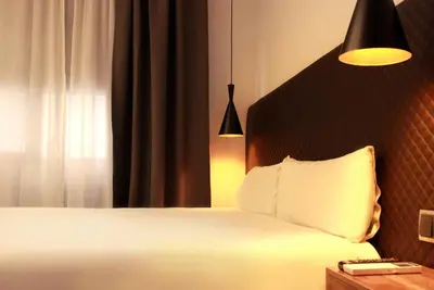 Cama o camas de una habitación en Woohoo Suites Madrid
