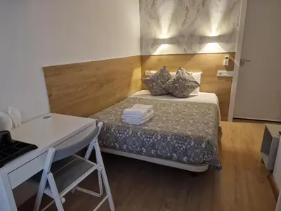 Cama o camas de una habitación en Hostal Esparteros