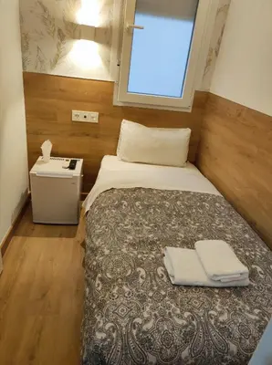 Cama o camas de una habitación en Hostal Esparteros