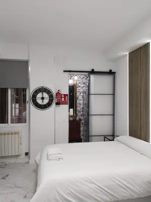 Cama o camas de una habitación en Malasaña Palma Studios