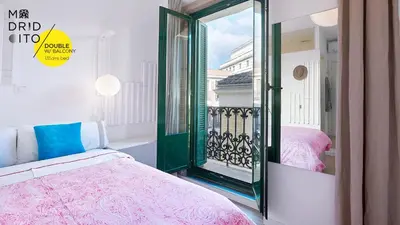 Cama o camas de una habitación en Madridcito
