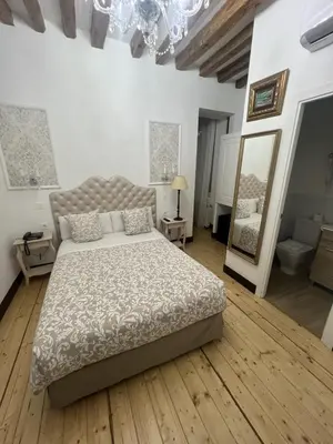 Cama o camas de una habitación en Oriente Palace Apartments