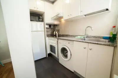 Una cocina o zona de cocina en Apartments Madrid Principe