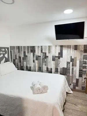 Cama o camas de una habitación en Apartamentos Day Madrid PLAZA DE ESPAÑA II
