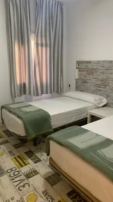 Cama o camas de una habitación en Casa de Huéspedes Almansa