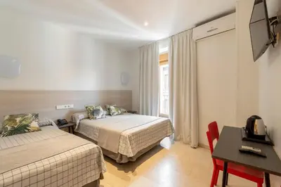 Cama o camas de una habitación en Hostal Castilla II Puerta del Sol