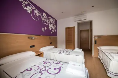 Cama o camas de una habitación en Hostal Carracedo