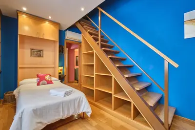 Cama o camas de una habitación en Apartamentos Carlos