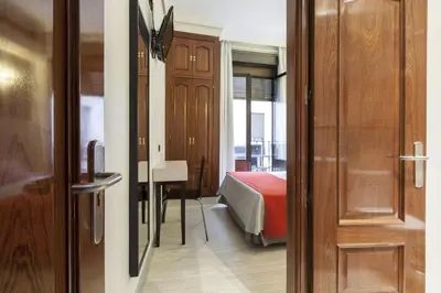 Cama o camas de una habitación en Hostal Castilla I Atocha