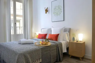 Cama o camas de una habitación en nQn Aparts & Suites Madrid
