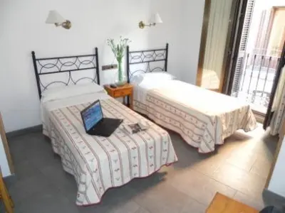 Cama o camas de una habitación en Hostal Ivor