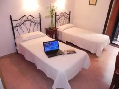 Cama o camas de una habitación en Hostal Ivor