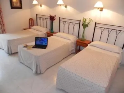 Cama o camas de una habitación en Hostal Ivor